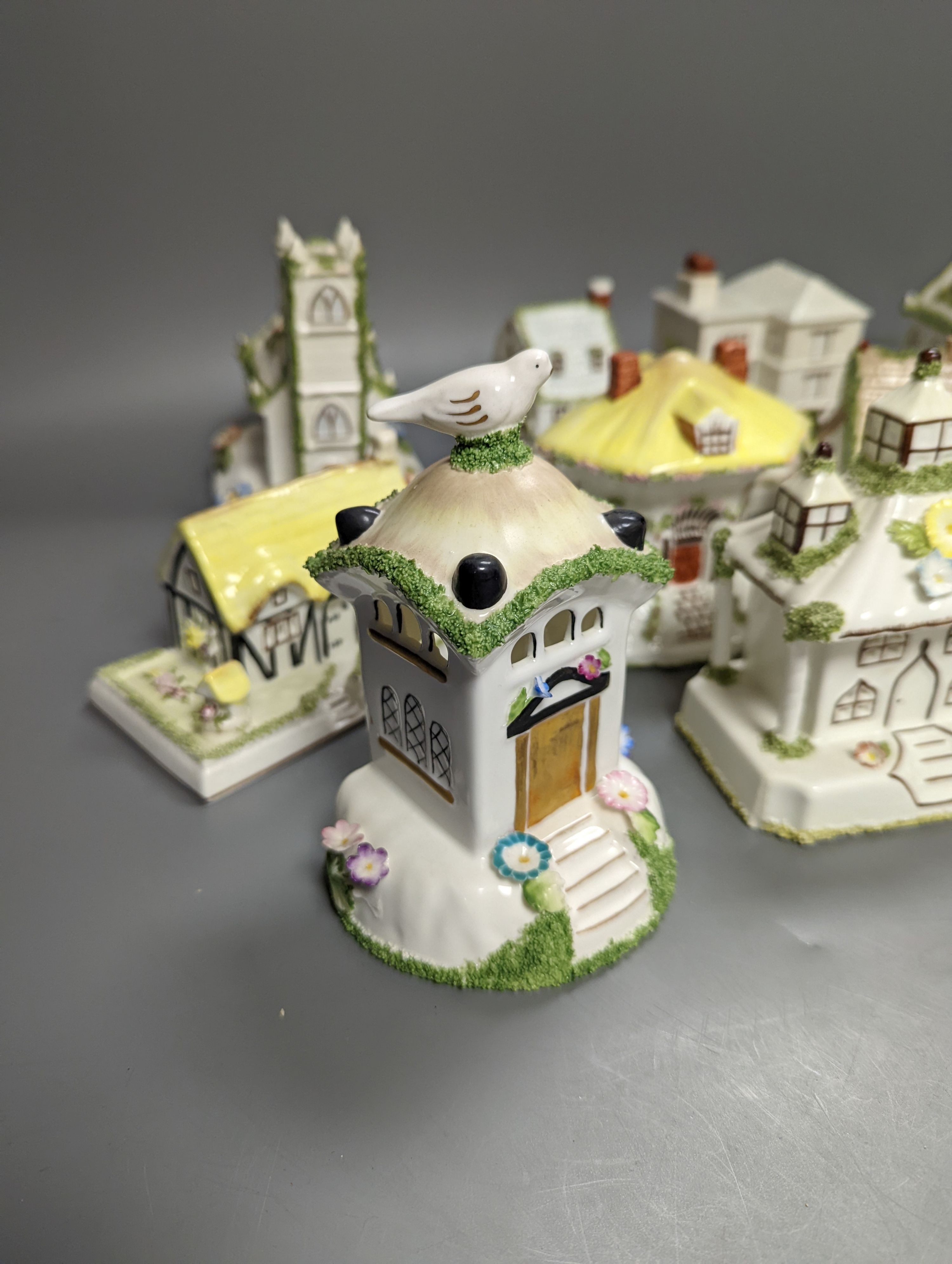 Twelve Coalport bone china pastille burner cottages and other buildings, tallest 14cms high